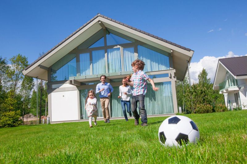 Worry-free family of four playing soccer in BC backyard