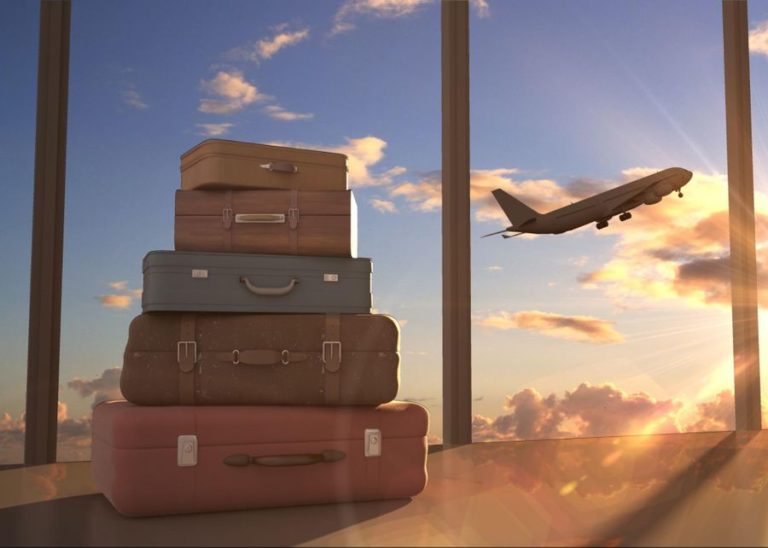 Suitcases left behind in the airport as plane takes off in the background