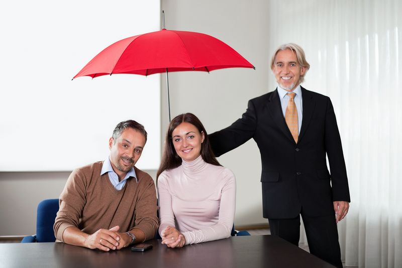 Agent providing insurance cover to a young couple