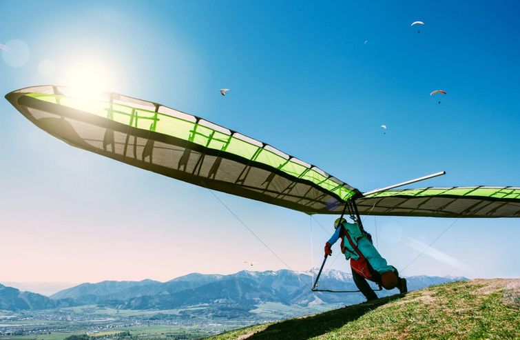 Extreme sports enthusiast about to take off on hang glider